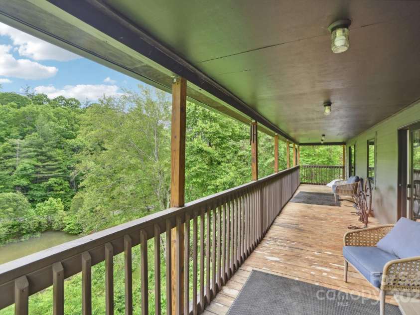 906 Merrills Cove Road, Asheville, NC 28803.  MLS# CAR4264221, YatesRealty ID 28089. Large main level covered deck