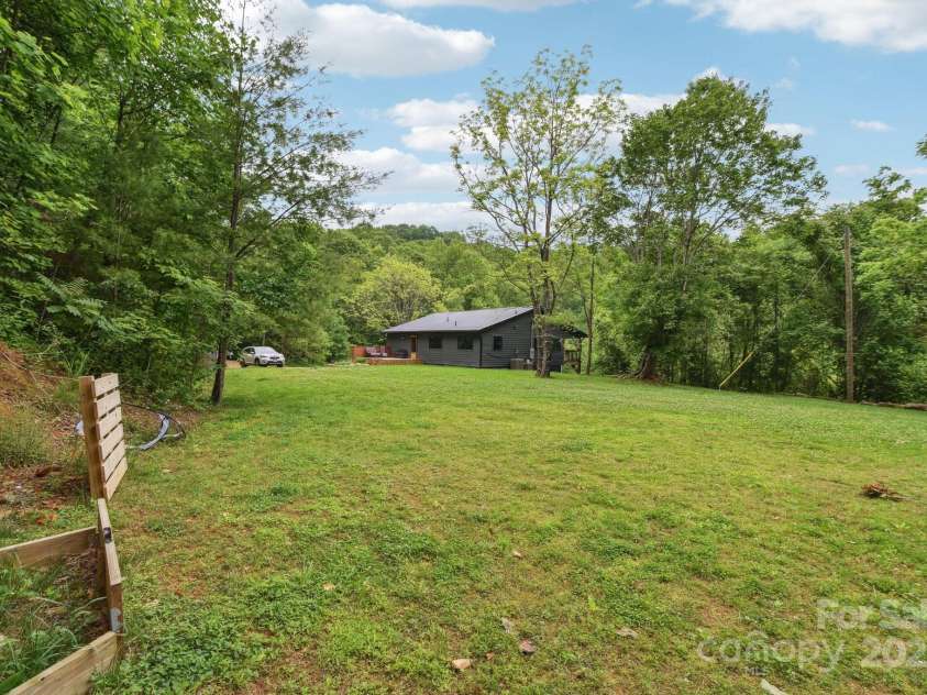 906 Merrills Cove Road, Asheville, NC 28803.  MLS# CAR4264221, YatesRealty ID 28089. Looking back towards house, so much room to play!