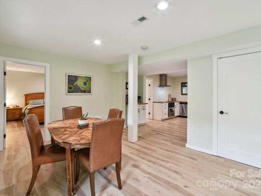906 Merrills Cove Road, Asheville, NC 28803.  MLS# CAR4264221, YatesRealty ID 28089. Lower level dining area