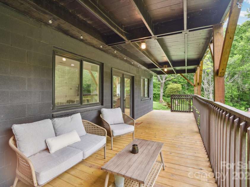 906 Merrills Cove Road, Asheville, NC 28803.  MLS# CAR4264221, YatesRealty ID 28089. Lower level opens on to deck