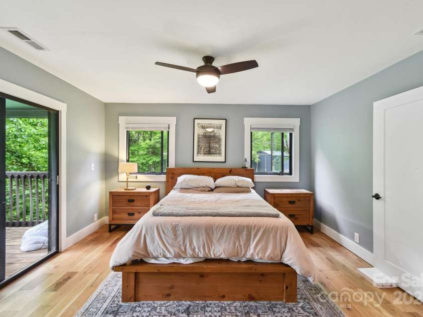 906 Merrills Cove Road, Asheville, NC 28803.  MLS# CAR4264221, YatesRealty ID 28089. Primary bedroom, slider opens on to deck