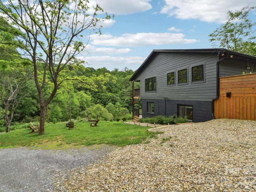 906 Merrills Cove Road, Asheville, NC 28803.  MLS# CAR4264221, YatesRealty ID 28089. Side view of house and driveway