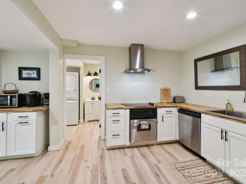 906 Merrills Cove Road, Asheville, NC 28803.  MLS# CAR4264221, YatesRealty ID 28089. Vented exhuast hood and butcher block countertops