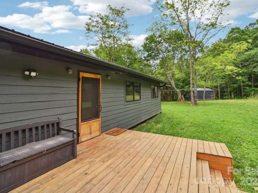906 Merrills Cove Road, Asheville, NC 28803.  MLS# CAR4264221, YatesRealty ID 28089. View of deck and entry door