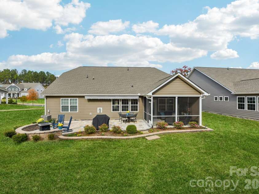 1328 Dali Boulevard, Mount Holly, NC 28120.  MLS# CAR4376476, YatesRealty ID 28096. Serene back patio and yard