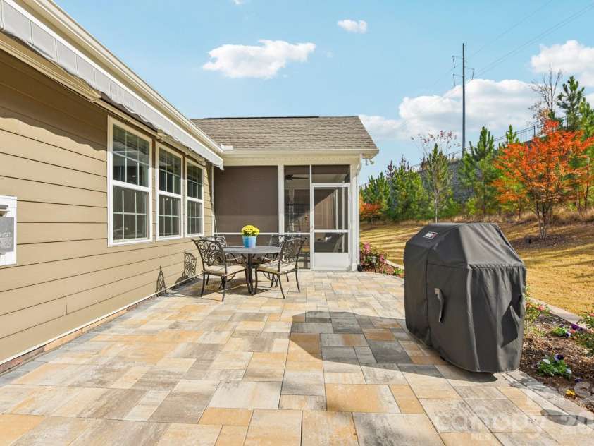 1328 Dali Boulevard, Mount Holly, NC 28120.  MLS# CAR4376476, YatesRealty ID 28096. Step out to the large paver patio that features a touch-button retractable awning!