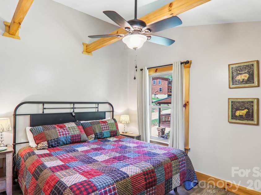 589 Panoramic Loop, Maggie Valley, NC 28751.  MLS# CAR4372216, YatesRealty ID 28097. 2nd bedroom - beamed ceilings