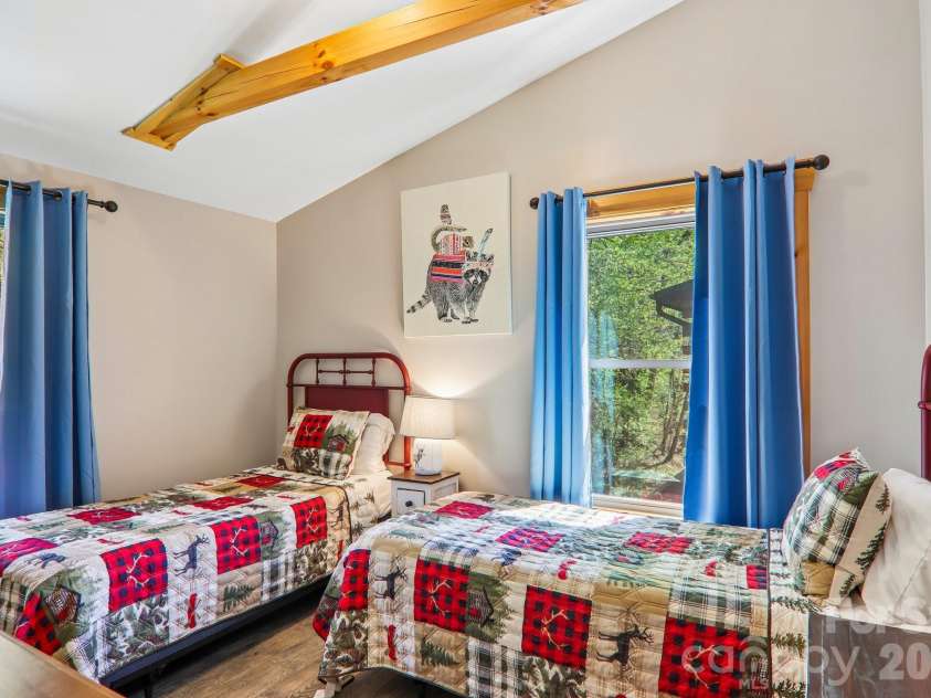 589 Panoramic Loop, Maggie Valley, NC 28751.  MLS# CAR4372216, YatesRealty ID 28097. 3rd guest room has beamed ceilings