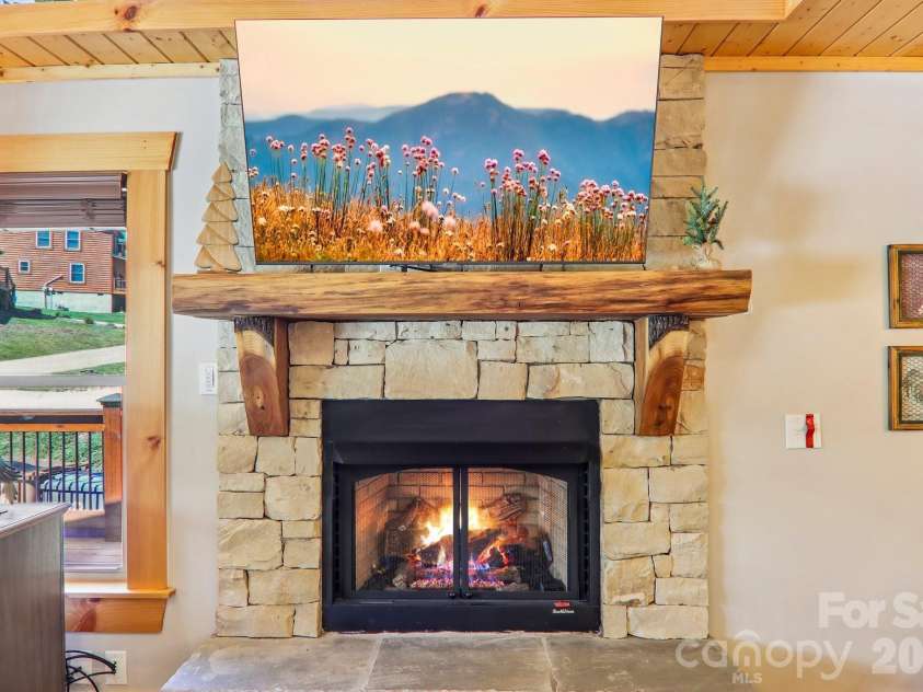 589 Panoramic Loop, Maggie Valley, NC 28751.  MLS# CAR4372216, YatesRealty ID 28097. Rustic fireplace