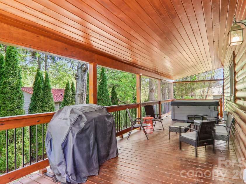 589 Panoramic Loop, Maggie Valley, NC 28751.  MLS# CAR4372216, YatesRealty ID 28097. Spacious back porch for privacy and hot tub