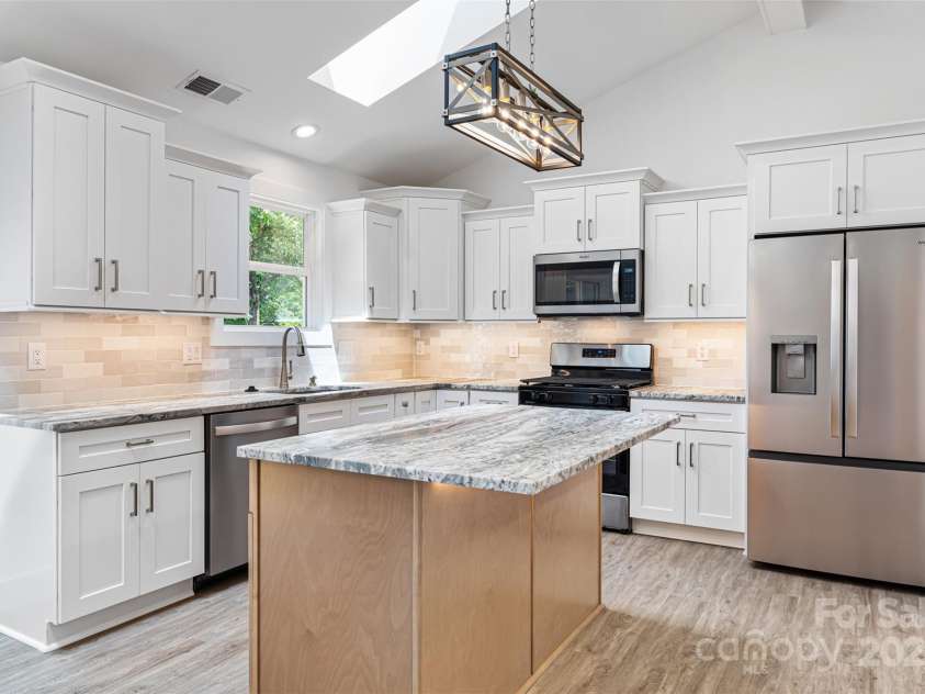 2027 Marquesas Avenue, Tega Cay, SC 29708.  MLS# CAR4262769, YatesRealty ID 28103. Kitchen with Island
