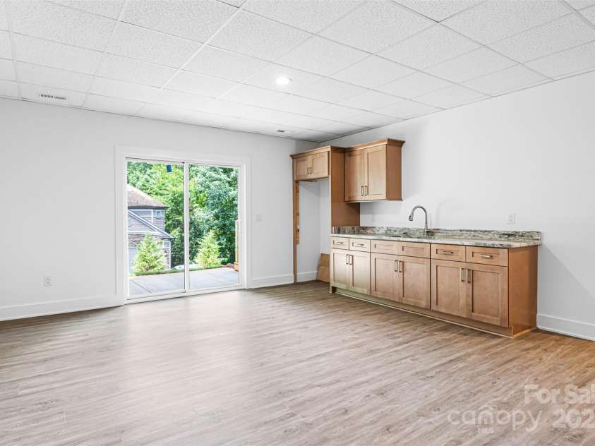 2027 Marquesas Avenue, Tega Cay, SC 29708.  MLS# CAR4262769, YatesRealty ID 28103. Lower level cabinetry for entertaining