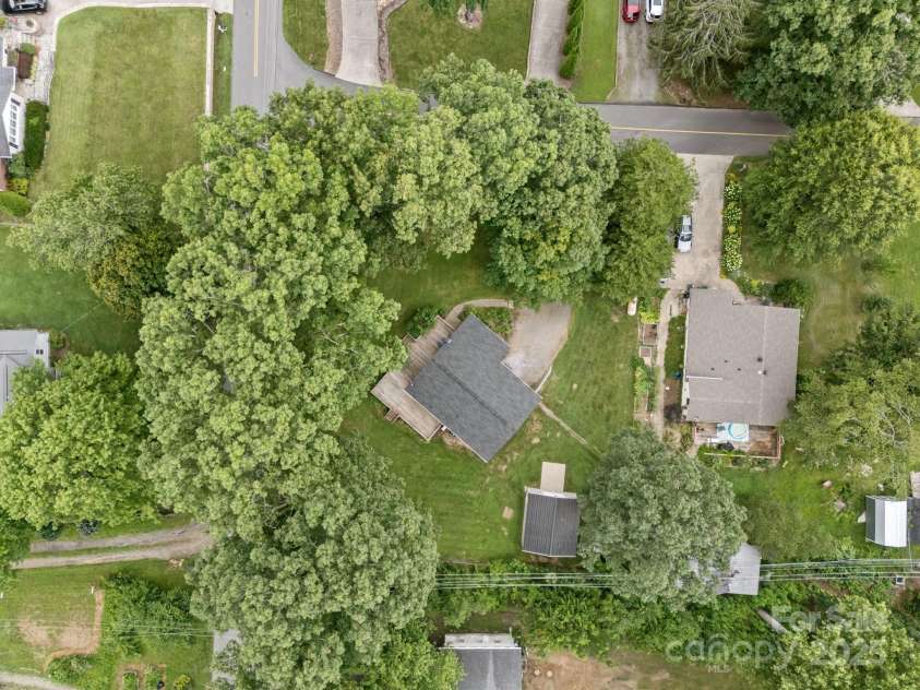 117 BeechTree Drive, Black Mountain, NC 28711.  MLS# CAR4281681, YatesRealty ID 28106. Aerial view- lots of privacy with mature shrubs and trees