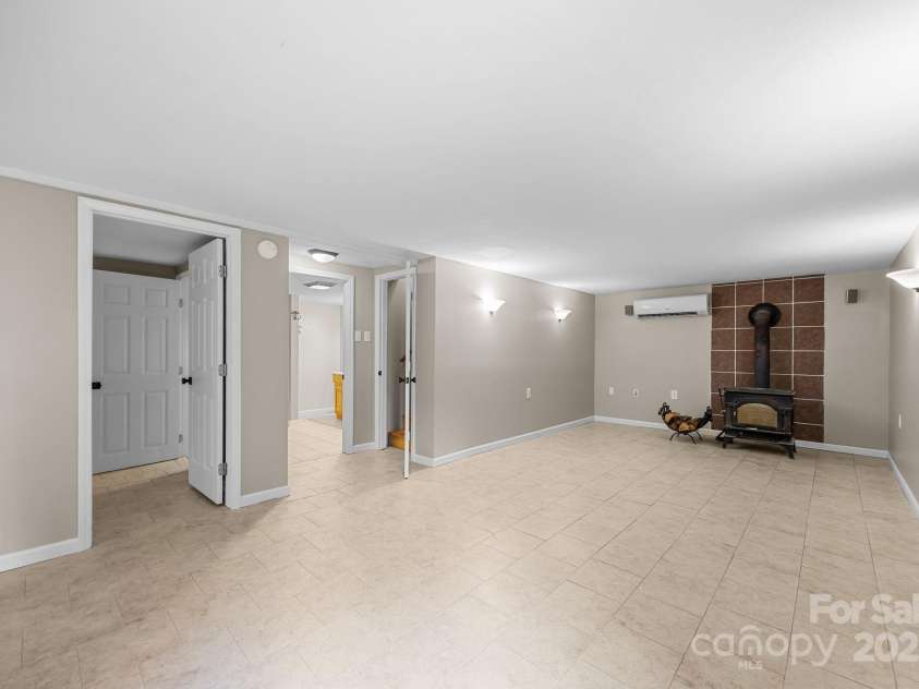 117 BeechTree Drive, Black Mountain, NC 28711.  MLS# CAR4281681, YatesRealty ID 28106. Downstairs family area