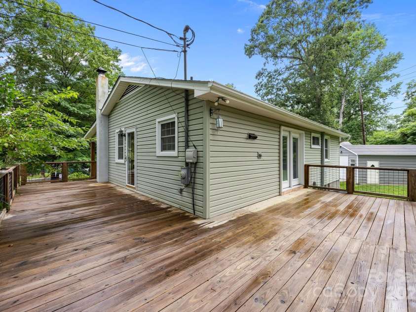 117 BeechTree Drive, Black Mountain, NC 28711.  MLS# CAR4281681, YatesRealty ID 28106. Wraps around half of the house with entrances to living room and kitchen