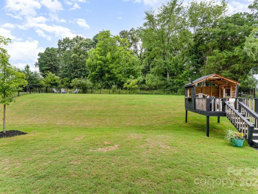 15230 Ravenall Drive, Huntersville, NC 28078.  MLS# CAR4243308, YatesRealty ID 28107. Don't miss the flat area at the top of the hill- great for a fire pit!