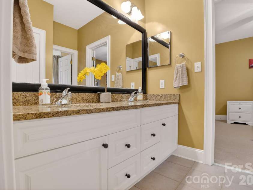 9533 Millen Drive, Harrisburg, NC 28075.  MLS# CAR4385489, YatesRealty ID 28108. Bathroom between 2 bedrooms