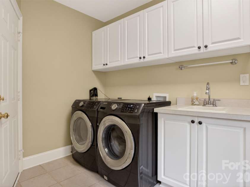 9533 Millen Drive, Harrisburg, NC 28075.  MLS# CAR4385489, YatesRealty ID 28108. Laundry room off garage