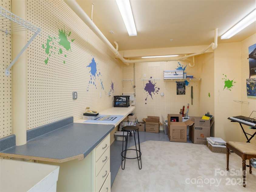 30 Hillcreek Drive, Asheville, NC 28804.  MLS# CAR4304208, YatesRealty ID 2811. Lower Level Craft Room