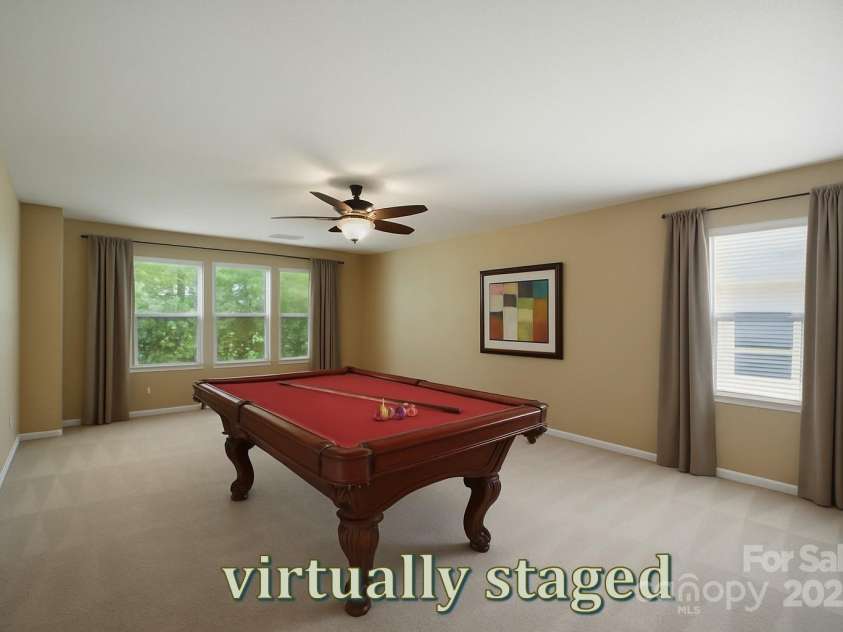 8604 Rockmoor Ridge Road, Charlotte, NC 28215.  MLS# CAR4268589, YatesRealty ID 28112. Game room, media room, craft space, the options are endless.