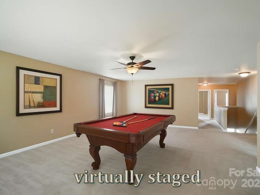 8604 Rockmoor Ridge Road, Charlotte, NC 28215.  MLS# CAR4268589, YatesRealty ID 28112. The loft is huge! Virtually staged.