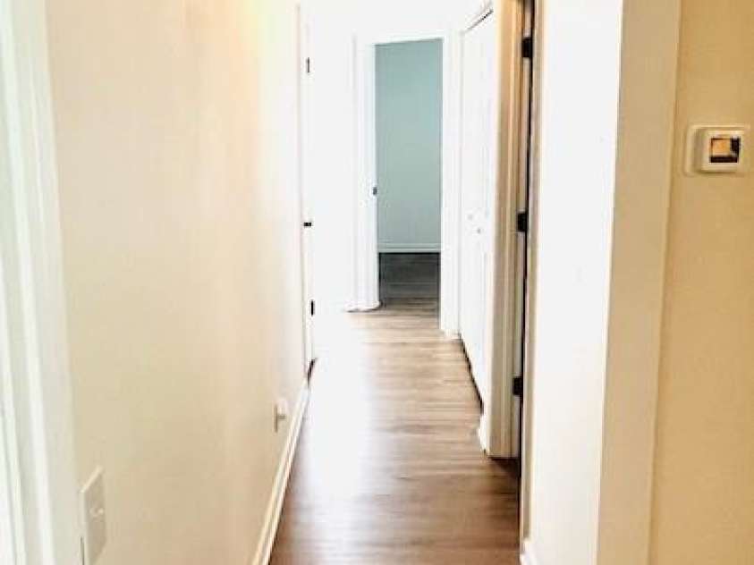 7215 Wingstone Lane, Charlotte, NC 28262.  MLS# CAR4274682, YatesRealty ID 28115. Hallway to second bathroom and bedrooms