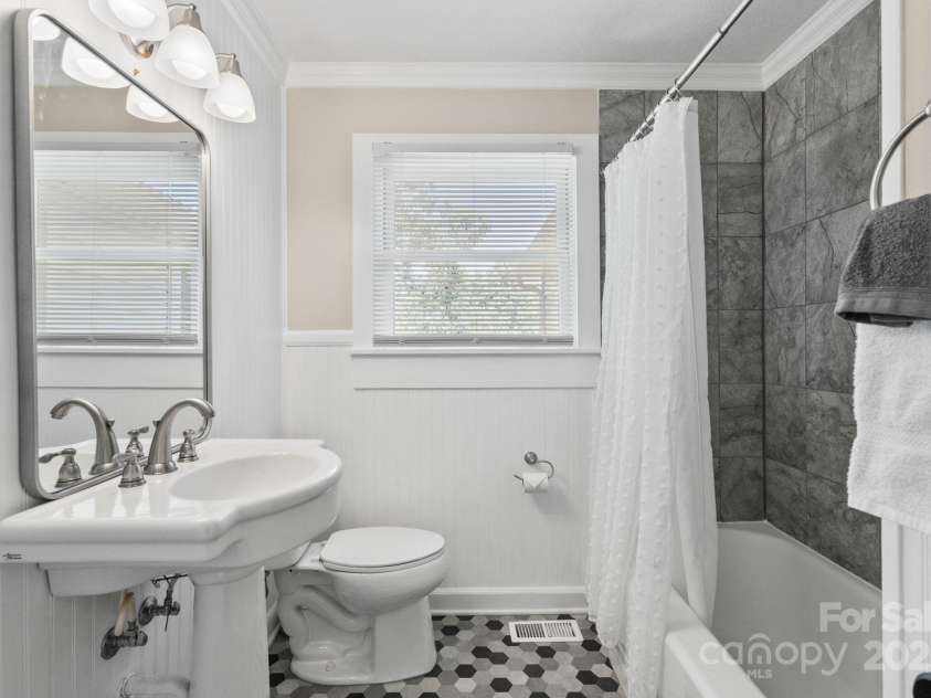 211 Woodland Road, Tryon, NC 28782.  MLS# CAR4274932, YatesRealty ID 28116. Hall Bathroom
