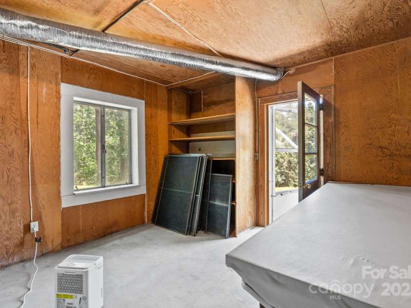 211 Woodland Road, Tryon, NC 28782.  MLS# CAR4274932, YatesRealty ID 28116. Unfinished basement area for storage etc