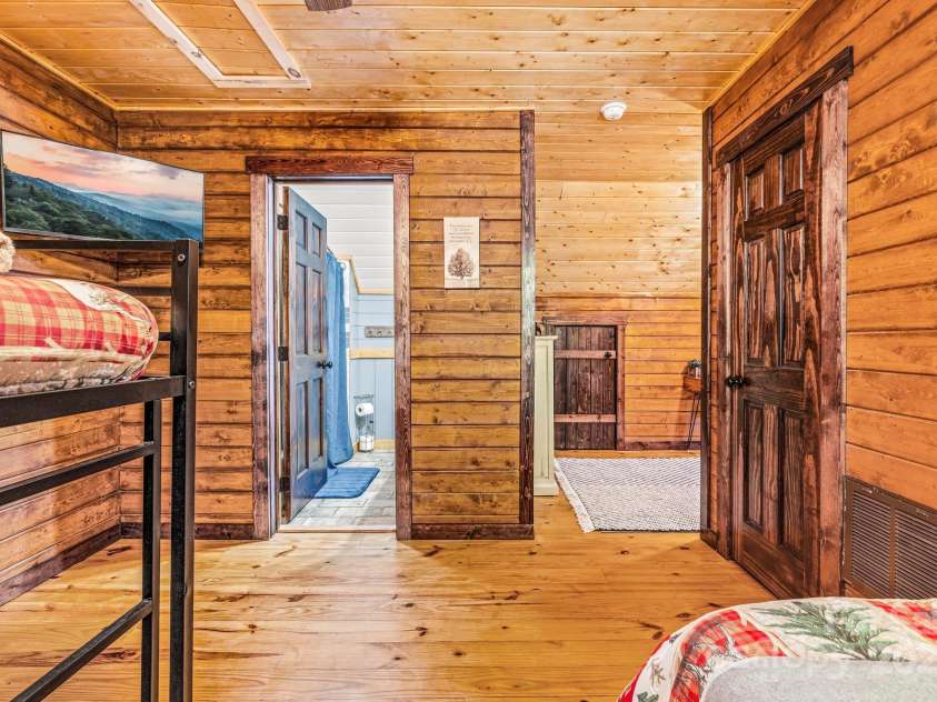 23 Hemlock Springs Road, Maggie Valley, NC 28751.  MLS# CAR4224375, YatesRealty ID 2812. 2nd Level en suite bedroom