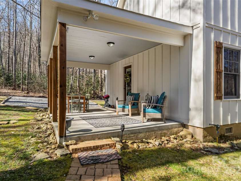 23 Hemlock Springs Road, Maggie Valley, NC 28751.  MLS# CAR4224375, YatesRealty ID 2812. Covered back porch