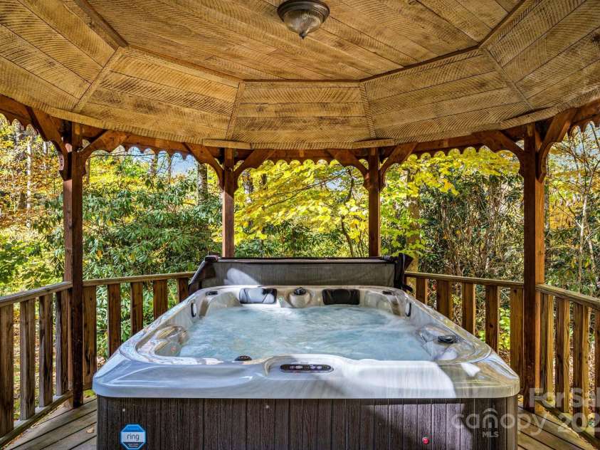 23 Hemlock Springs Road, Maggie Valley, NC 28751.  MLS# CAR4224375, YatesRealty ID 2812. Your own hot tub oasis