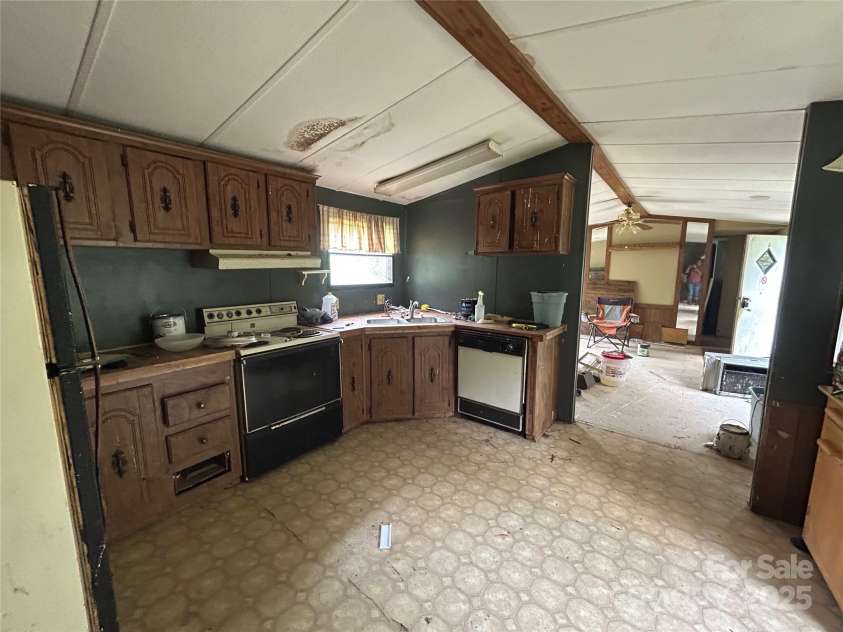 3485 Cedar Circle Road, Lancaster, SC 29720.  MLS# CAR4300756, YatesRealty ID 2812. Kitchen - looking into living room and 2nd bedroom