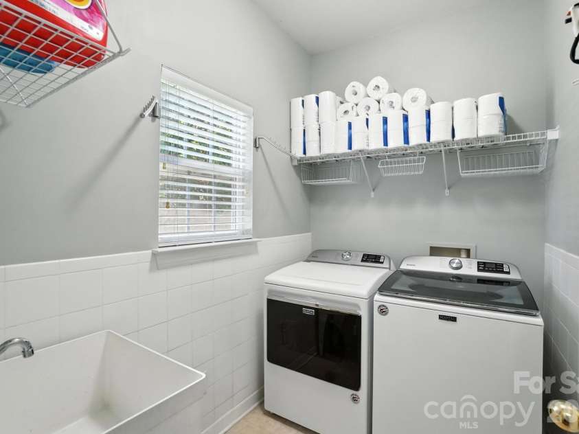 4819 Sandtyn Drive, Waxhaw, NC 28173.  MLS# CAR4282295, YatesRealty ID 28120. Downstairs Laundry Room