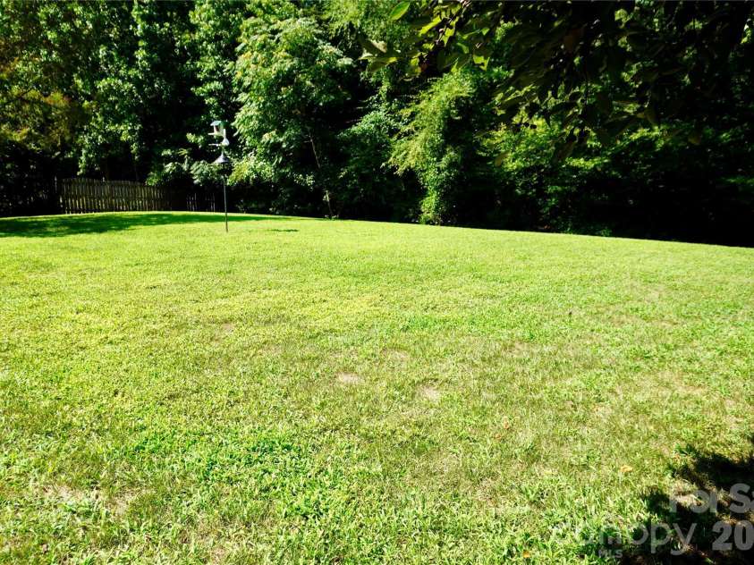 4819 Sandtyn Drive, Waxhaw, NC 28173.  MLS# CAR4282295, YatesRealty ID 28120. Gorgeous private, level yard