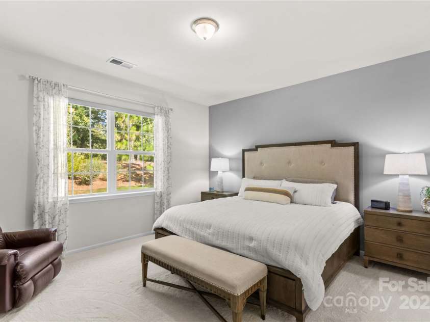 14036 Asbury Park Road, Huntersville, NC 28078.  MLS# CAR4283671, YatesRealty ID 28122. Bright and spacious primary bedroom with private backyard view