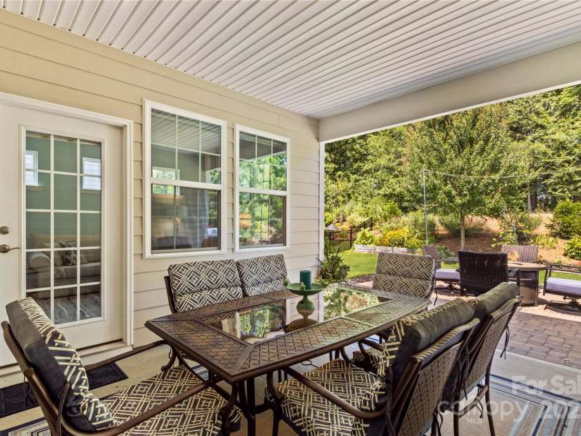 14036 Asbury Park Road, Huntersville, NC 28078.  MLS# CAR4283671, YatesRealty ID 28122. Covered porch overlook private backyard patio and treelined views