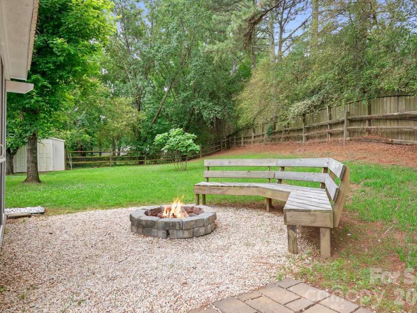 8940 Raven Park Drive, Charlotte, NC 28216.  MLS# CAR4388113, YatesRealty ID 28123. Cozy firepit