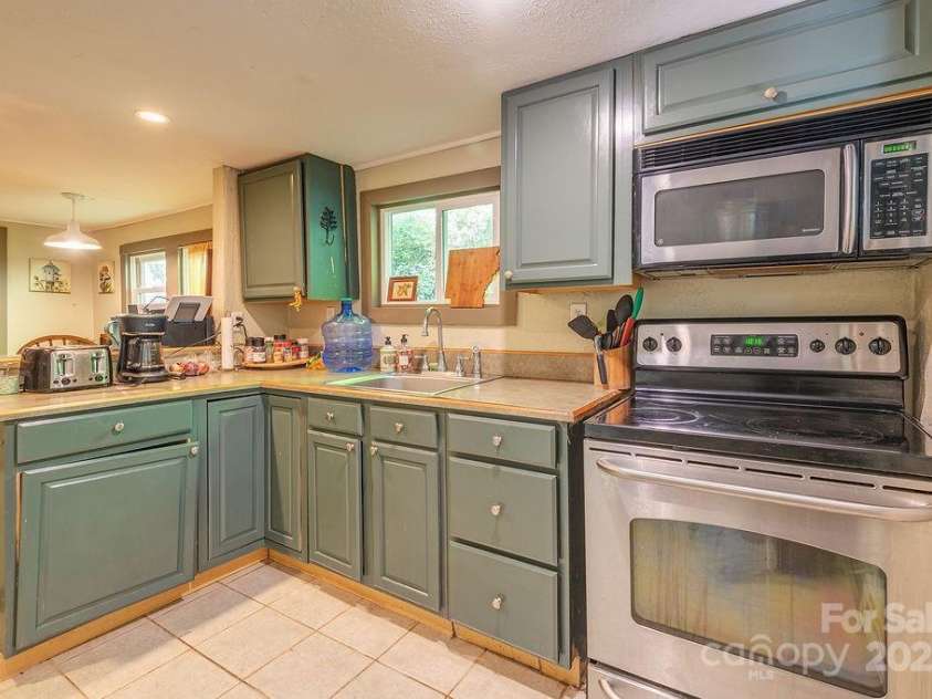 67 Hardwick Branch Drive, Marshall, NC 28753.  MLS# CAR4278381, YatesRealty ID 28124. 