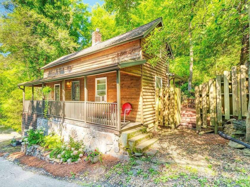 67 Hardwick Branch Drive, Marshall, NC 28753.  MLS# CAR4278381, YatesRealty ID 28124. Charming mountain cottage in the woods