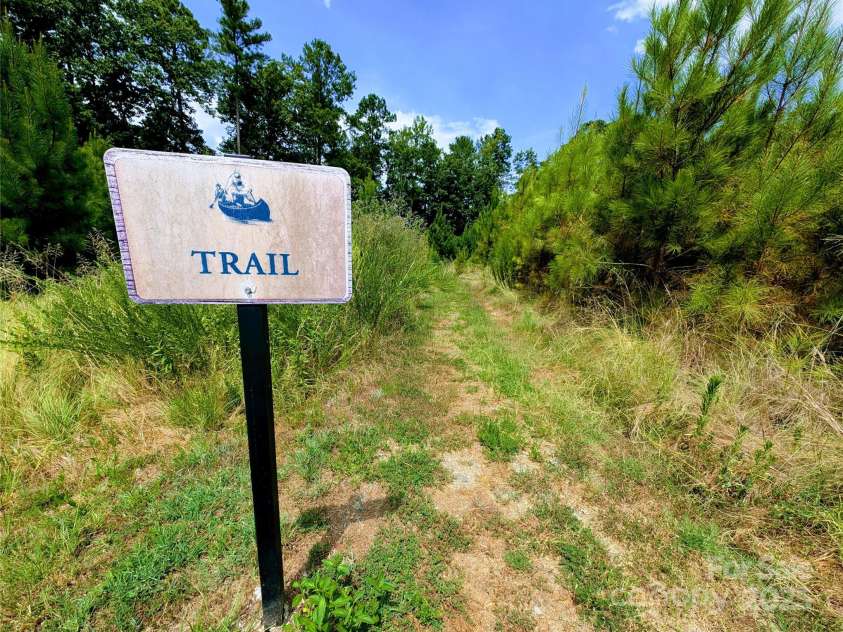 239 Kentmere Lane, Clover, SC 29710.  MLS# CAR4283271, YatesRealty ID 28125. Summerhouse pond with walking trail