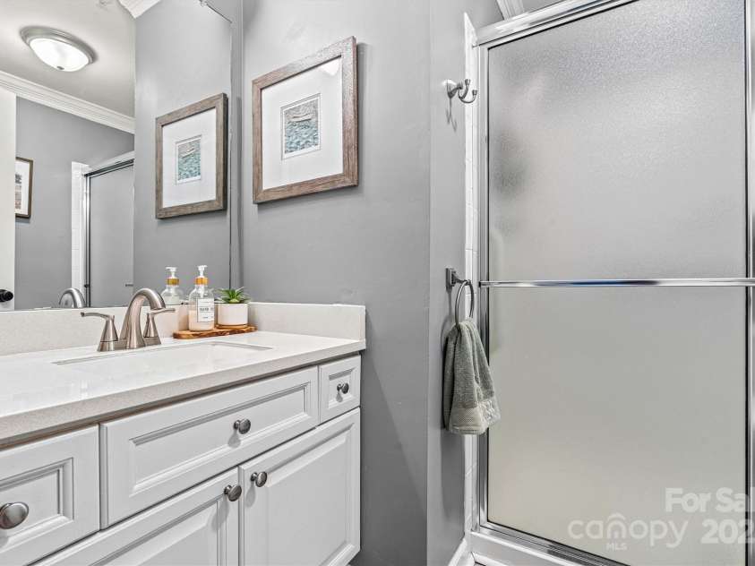 860 Jetton Street, Davidson, NC 28036.  MLS# CAR4269075, YatesRealty ID 28128. Guest bathroom with stand up shower