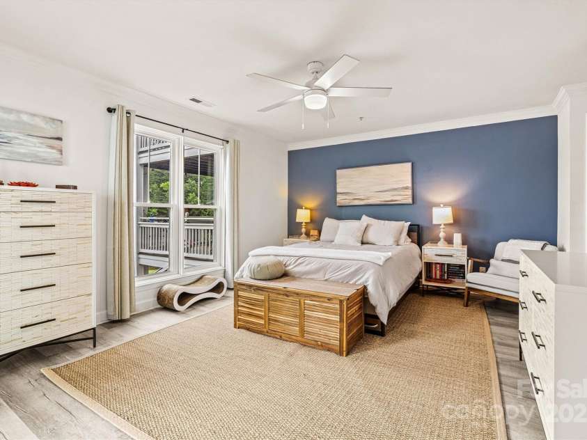 860 Jetton Street, Davidson, NC 28036.  MLS# CAR4269075, YatesRealty ID 28128. Primary bedroom with beautiful accent wall