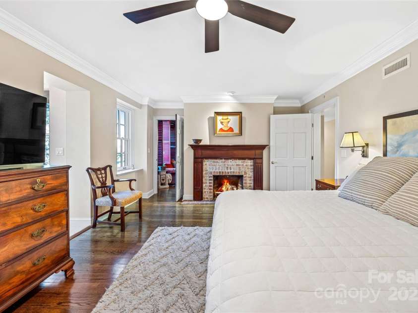 185 Macon Avenue, Asheville, NC 28804.  MLS# CAR4329475, YatesRealty ID 28133. Fireplace in the primary bedroom