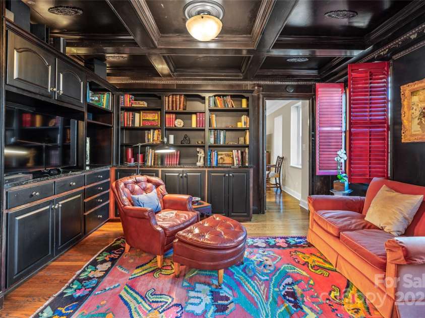 185 Macon Avenue, Asheville, NC 28804.  MLS# CAR4329475, YatesRealty ID 28133. Keeping room with built-ins between the dining room and the primary suite