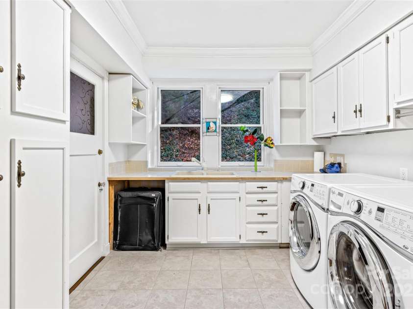 185 Macon Avenue, Asheville, NC 28804.  MLS# CAR4329475, YatesRealty ID 28133. Large laundry room with built-ins