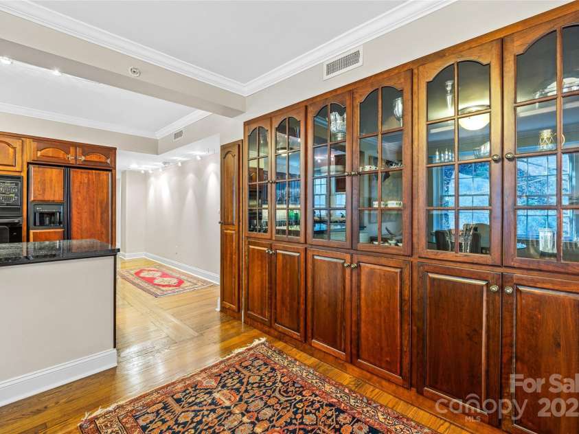 185 Macon Avenue, Asheville, NC 28804.  MLS# CAR4329475, YatesRealty ID 28133. More built-in cabinets in the breakfast room