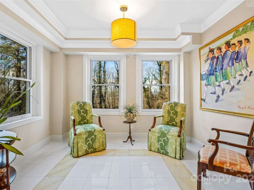 185 Macon Avenue, Asheville, NC 28804.  MLS# CAR4329475, YatesRealty ID 28133. Sunroom off the living room