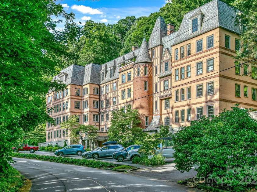 185 Macon Avenue, Asheville, NC 28804.  MLS# CAR4329475, YatesRealty ID 28133. Welcome to Longchamp located across from the Grove Park Inn.