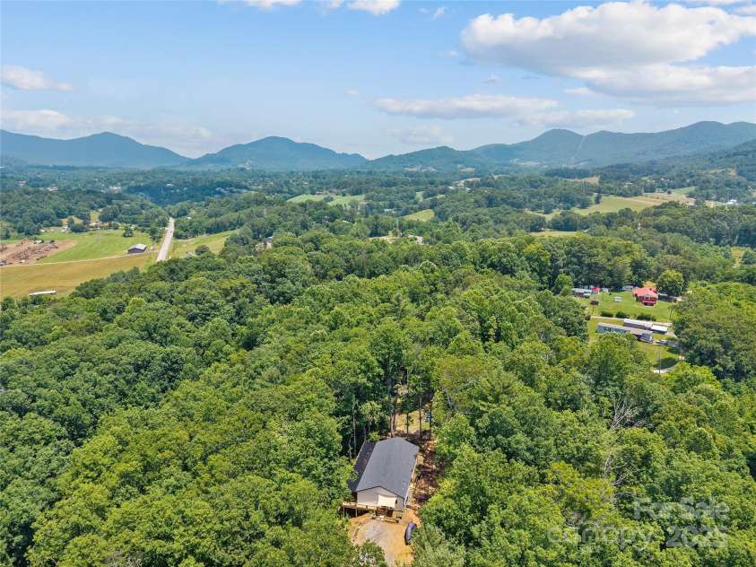 54 Bittersweet Trail, Canton, NC 28716.  MLS# CAR4271698, YatesRealty ID 28134. End of the road, top of the hill, and nestled among the trees for the ultimate in privacy! Located just minutes to downtown Canton with it's charming shops and restaurants, and less than 20 minutes to downtown Waynesvill