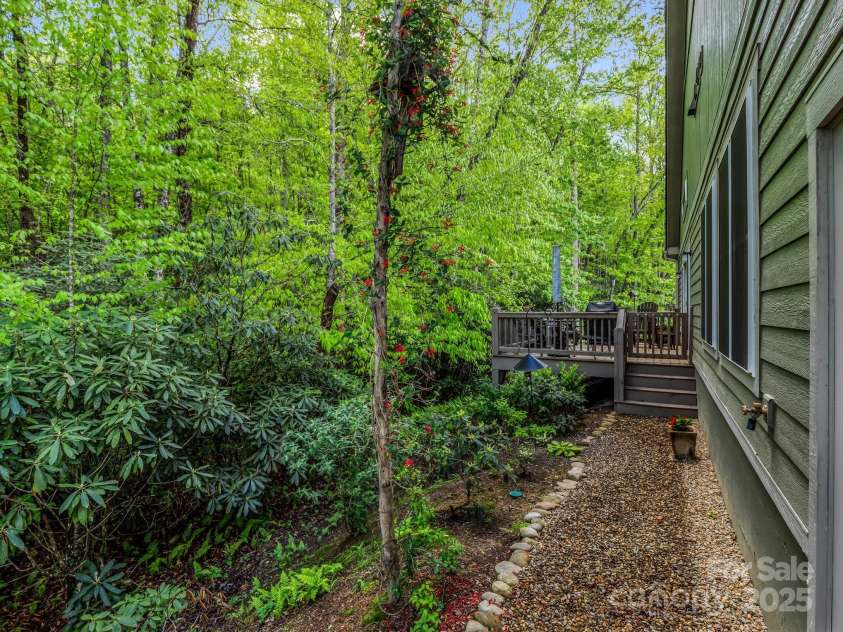 29 Stonehollow Lane, Brevard, NC 28712.  MLS# CAR4282263, YatesRealty ID 28142. Side walkway